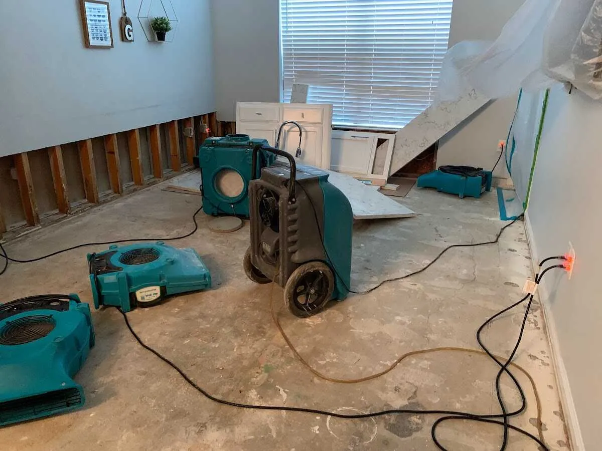 Dehumidifier in flood-cut room for Water Damage Restoration in Cameron